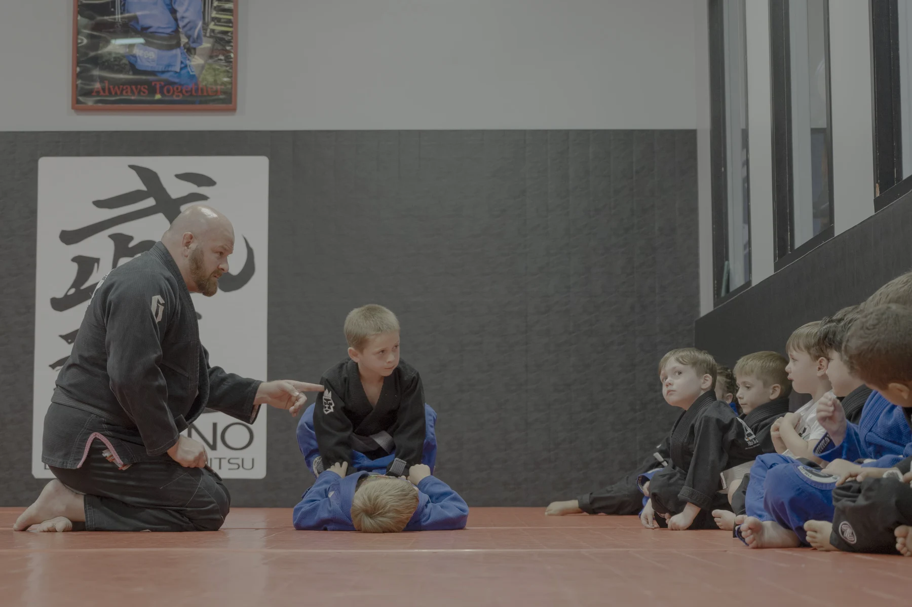 An instructor demonstrating a technique to the Altus kids class