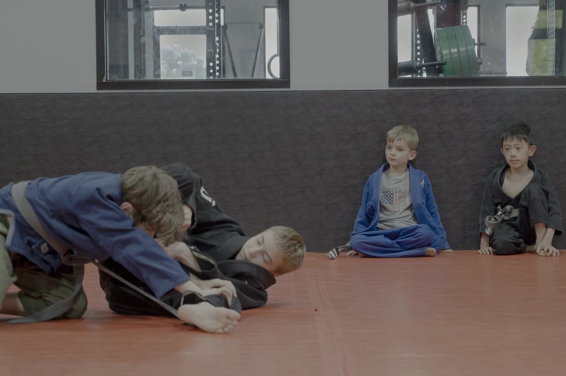 Young training partners practicing on the Altus mats