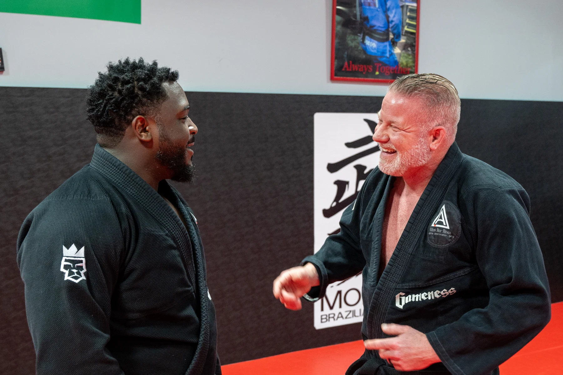 Altus training partners smiling together on the mats