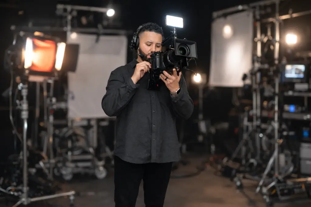 Luis Rivera working behind a cinema camera at an event